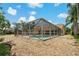 Screened pool with stone landscaping, providing a tranquil outdoor space to unwind and relax at 1046 Middlesex Dr, New Port Richey, FL 34655