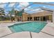 A screened-in pool with a large deck for entertaining and easy access to the home at 1046 Middlesex Dr, New Port Richey, FL 34655