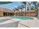 A screened-in pool with a large deck for entertaining at 1046 Middlesex Dr, New Port Richey, FL 34655
