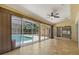 Spacious sun room with multiple sliding glass doors leading to the pool area at 1046 Middlesex Dr, New Port Richey, FL 34655