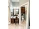 Bathroom boasts vanity area and adjacent toilet with dark wood cabinets and drawers at 11501 Norval Pl, Temple Terrace, FL 33617