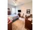 Bedroom featuring neutral carpet, a ceiling fan, and comfortable furnishings at 11501 Norval Pl, Temple Terrace, FL 33617