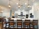Spacious kitchen island offers seating, complemented by stylish pendant lighting and modern appliances at 11501 Norval Pl, Temple Terrace, FL 33617