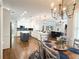 Open kitchen features white cabinets, island, and seamless transition to living area, perfect for entertaining at 11501 Norval Pl, Temple Terrace, FL 33617