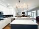 Open kitchen with an island, modern appliances, and a seamless transition to the living area at 11501 Norval Pl, Temple Terrace, FL 33617