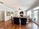 Inviting living room featuring a brick fireplace, built-in cabinets, and ample natural light at 11501 Norval Pl, Temple Terrace, FL 33617