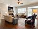 Bright and airy living room with a fireplace, plenty of seating, and backyard views at 11501 Norval Pl, Temple Terrace, FL 33617