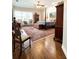 Comfortable main bedroom with natural light, traditional décor, and classic wood floors at 11501 Norval Pl, Temple Terrace, FL 33617