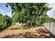 Expansive backyard featuring mature trees and lush lawn, perfect for outdoor enjoyment at 11783 102Nd Ave, Largo, FL 33778