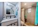 Modern bathroom features a gray frame mirror and walk-in shower at 11783 102Nd Ave, Largo, FL 33778