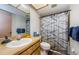 Bathroom with wood vanity and marble-look shower curtain at 11783 102Nd Ave, Largo, FL 33778