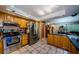 Spacious kitchen featuring wood cabinets, stainless steel appliances, and tiled flooring at 11783 102Nd Ave, Largo, FL 33778