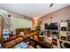 Cozy living room featuring vaulted ceilings, plush seating, and natural light at 11783 102Nd Ave, Largo, FL 33778