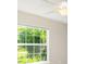Bedroom featuring a large window, tile flooring and a ceiling fan at 13116 Marathon Blvd, Port Charlotte, FL 33981