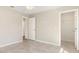 Bright bedroom with tile flooring leading to a walk-in closet, and a bathroom that provides ample storage at 13116 Marathon Blvd, Port Charlotte, FL 33981
