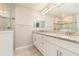 Elegant main bathroom with granite countertop vanity, dual sinks, and tiled walk-in shower and backsplash at 13116 Marathon Blvd, Port Charlotte, FL 33981