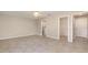 Spacious main bedroom featuring tile flooring, a ceiling fan, and an ensuite bathroom with a walk-in closet at 13116 Marathon Blvd, Port Charlotte, FL 33981