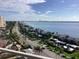 Aerial view of buildings, lush streetscapes, the Intracoastal Waterway and the Gulf of Mexico at 1340 Gulf Blvd # 12A, Clearwater Beach, FL 33767