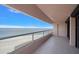 Balcony featuring glass railings with panoramic views of the beach and ocean at 1340 Gulf Blvd # 12A, Clearwater Beach, FL 33767
