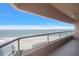 Wide shot of a balcony featuring glass railings with a view of the beach and ocean at 1340 Gulf Blvd # 12A, Clearwater Beach, FL 33767