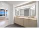 Primary bathroom featuring a double vanity with tile flooring, mirror, and walk-in shower at 1340 Gulf Blvd # 12A, Clearwater Beach, FL 33767