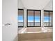 The primary bathroom features a large soaking tub with views of the outside at 1340 Gulf Blvd # 12A, Clearwater Beach, FL 33767