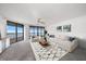 Bright living room with neutral colors, modern furniture, ocean views, and a decorative area rug at 1340 Gulf Blvd # 12A, Clearwater Beach, FL 33767