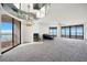 Bright living room with a fireplace, ceiling mirror, and large windows showcasing an ocean view at 1340 Gulf Blvd # 12A, Clearwater Beach, FL 33767
