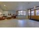 Large lobby with comfortable seating, tile floors, shutters and access to the exterior at 1340 Gulf Blvd # 12A, Clearwater Beach, FL 33767