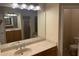 Bathroom with double sink vanity with stone countertops and tile flooring and backsplash at 1353 El Pardo Dr, Trinity, FL 34655