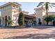 Elegant clubhouse featuring terra cotta roof, arched entryway, and beautiful landscaping at 1353 El Pardo Dr, Trinity, FL 34655