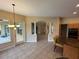 Bright kitchen eat-in nook with modern lighting, view of the tiled flooring, and open archway to dining at 1353 El Pardo Dr, Trinity, FL 34655