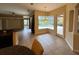 Kitchen nook with seating and a view of the pool and lanai through sliding glass doors at 1353 El Pardo Dr, Trinity, FL 34655