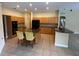 Bright kitchen featuring wooden cabinets, granite countertops, and modern appliances for a functional cooking space at 1353 El Pardo Dr, Trinity, FL 34655