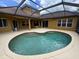 Large private pool with ample patio space and an overhead screened enclosure to keep pests away at 1353 El Pardo Dr, Trinity, FL 34655