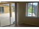 Bright sunroom with large window views to the pool area and an adjacent view of the lanai at 1353 El Pardo Dr, Trinity, FL 34655