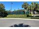Well-maintained tennis court surrounded by lush landscaping and mature trees at 1353 El Pardo Dr, Trinity, FL 34655