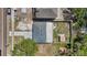 Bird's eye view of the home shows the roof, yard, shed, and surrounding neighborhood at 1406 Nebraska Ave, Palm Harbor, FL 34683