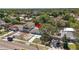 Aerial view of the home shows the yard, street, and neighborhood at 1406 Nebraska Ave, Palm Harbor, FL 34683