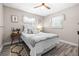 Cozy bedroom with neutral tones, two windows, and stylish decor at 1406 Nebraska Ave, Palm Harbor, FL 34683