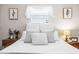 Comfortable bedroom featuring bright natural light, plush pillows, and classic decor at 1406 Nebraska Ave, Palm Harbor, FL 34683