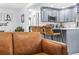 Modern kitchen featuring stainless steel appliances, ample counter space, and sleek bar seating for casual dining at 1406 Nebraska Ave, Palm Harbor, FL 34683