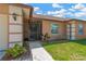Covered and screened front porch and walkway on a home with neutral paint and white trim at 1604 Dusty Rose Ln, Brandon, FL 33510