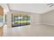 Open living area with sliding glass doors that fill the space with natural light and access to the yard at 1604 Dusty Rose Ln, Brandon, FL 33510
