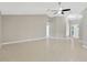 Open concept living room featuring neutral paint colors and easy access to the front door at 1604 Dusty Rose Ln, Brandon, FL 33510