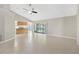 Spacious living room with sliding glass door to lanai, open to the kitchen and featuring tile floors at 1604 Dusty Rose Ln, Brandon, FL 33510