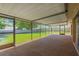 Inviting screened-in patio perfect for outdoor living with views of the green backyard at 1604 Dusty Rose Ln, Brandon, FL 33510