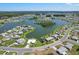 High angle view of a lakeside residential area featuring charming homes and lush landscaping at 1717 Danbury Dr, Sun City Center, FL 33573