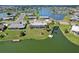 Backyard of a waterfront home featuring a private dock and access to a tranquil lake at 1717 Danbury Dr, Sun City Center, FL 33573