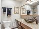 Elegant bathroom featuring a bowl sink, toilet, and framed art at 1717 Danbury Dr, Sun City Center, FL 33573